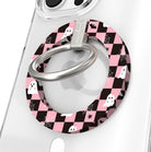 Hey Boo, Looking Cute Hold It Fancy MagSafe grip ring shown on a clear iPhone case, pink and black checkerboard with white ghosts around the silver ring.