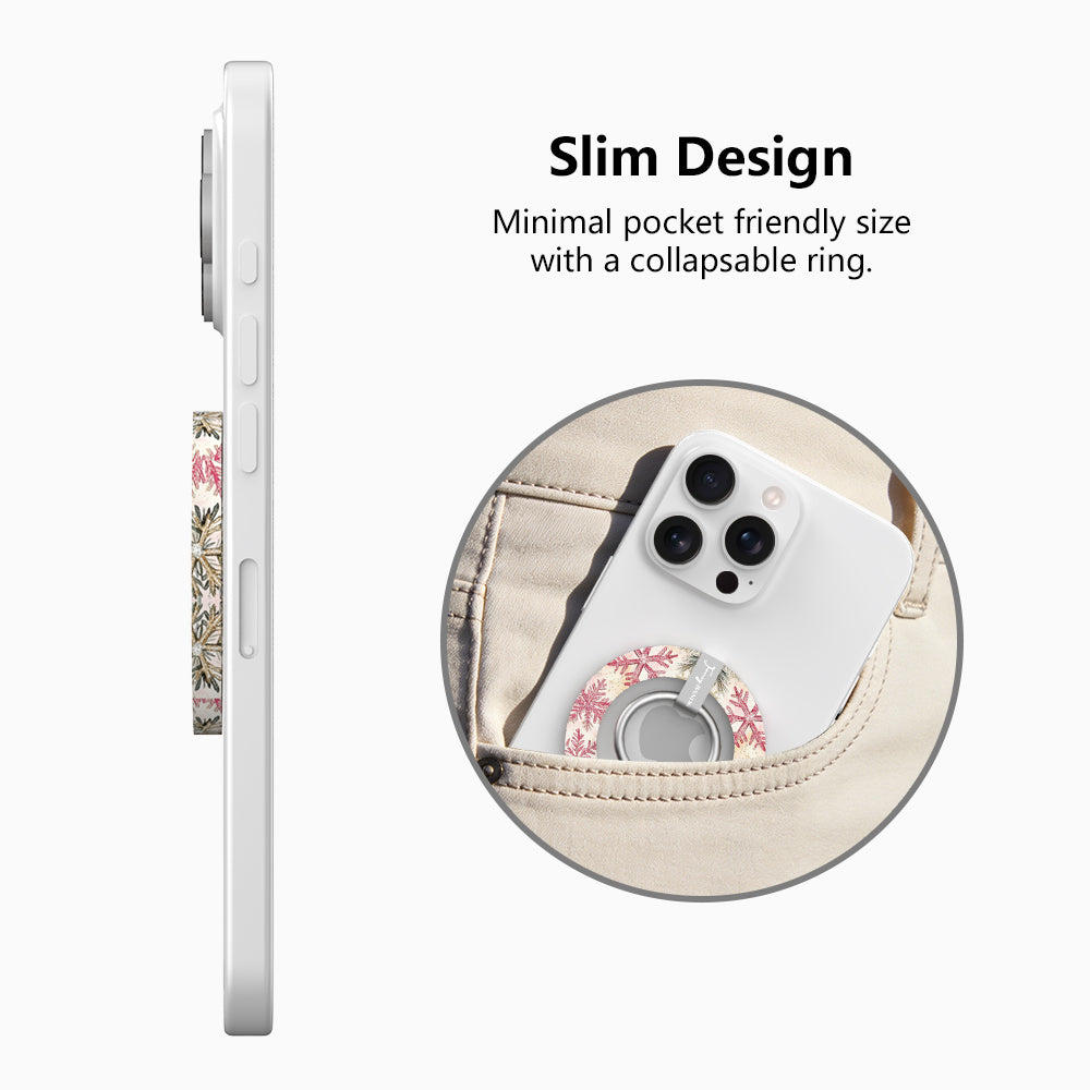 Side view of the slim Champagne Snowfall grip ring with collapsible ring, and a phone with the snowflake grip sliding into a jeans pocket