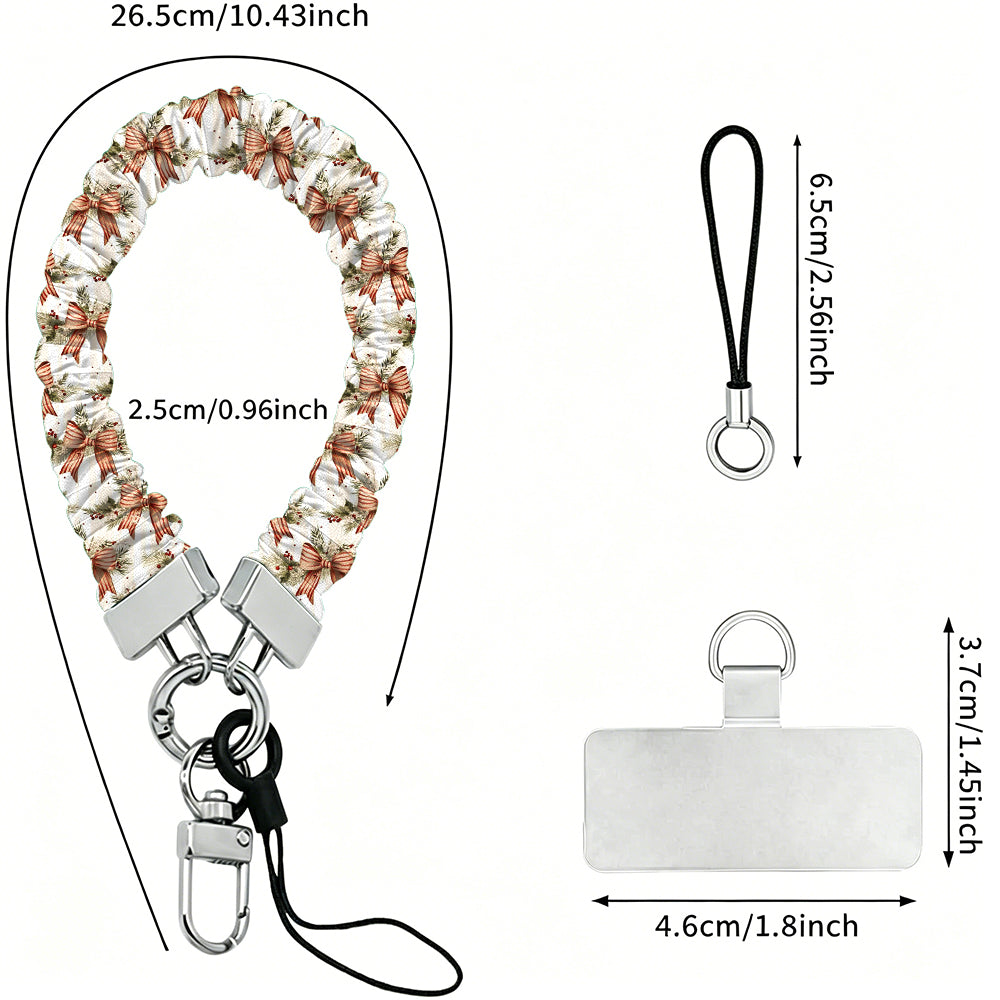 Deck Yourself in Bows & Holly scrunchie wrist strap dimensions: 26.5 cm strap, 2.5 cm wide, 6.5 cm loop, 4.6 x 3.7 cm phone tab