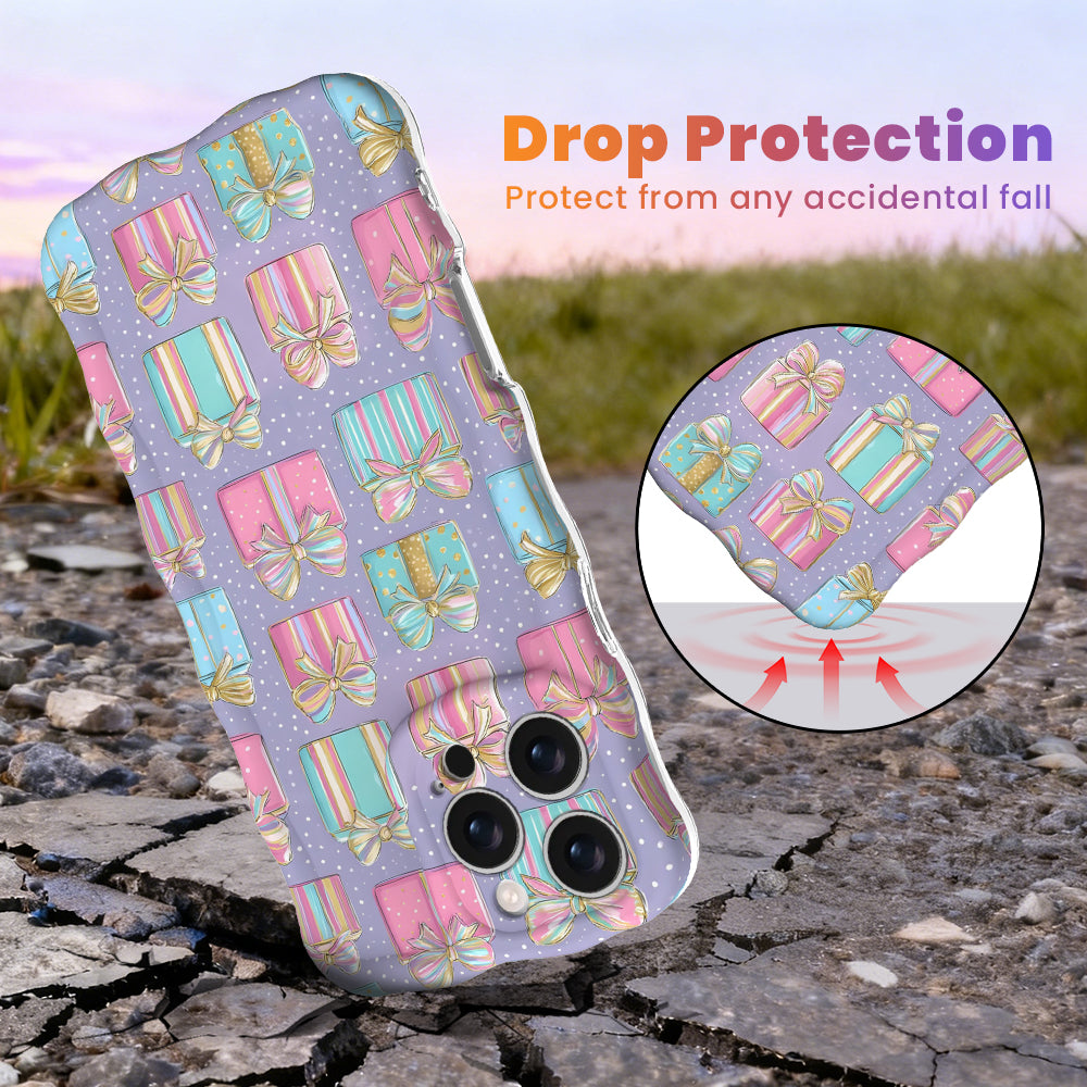 No Peeking, Darling Wavy Luxe MagSafe iPhone case with pastel Christmas presents on lavender, with shock-absorbing corners for drop protection