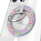 Close-up of the No Peeking, Darling MagSafe grip ring with pastel presents on lavender and a brushed silver ring on a clear iPhone case