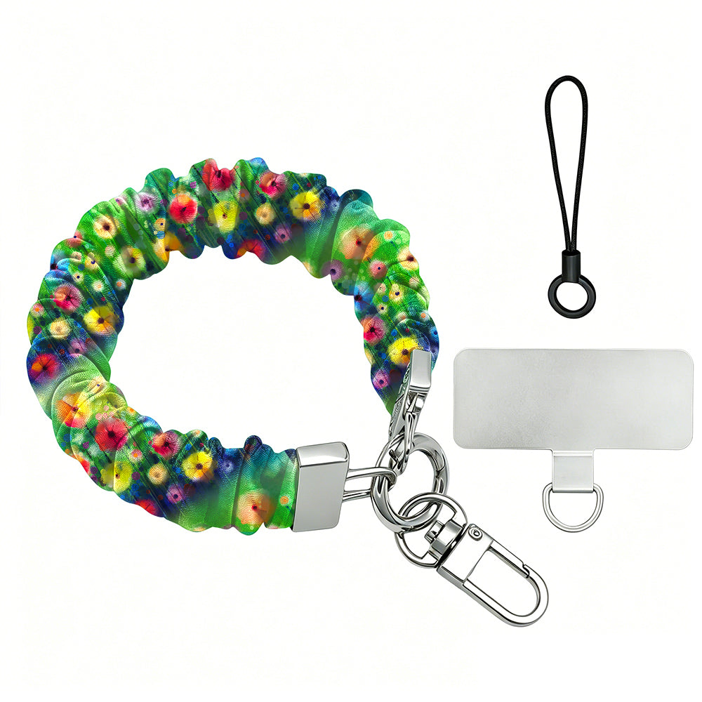 Petal Princess scrunchie phone wrist strap in a painted rainbow wildflower print with silver clasp and clear phone attachment tab on a white background