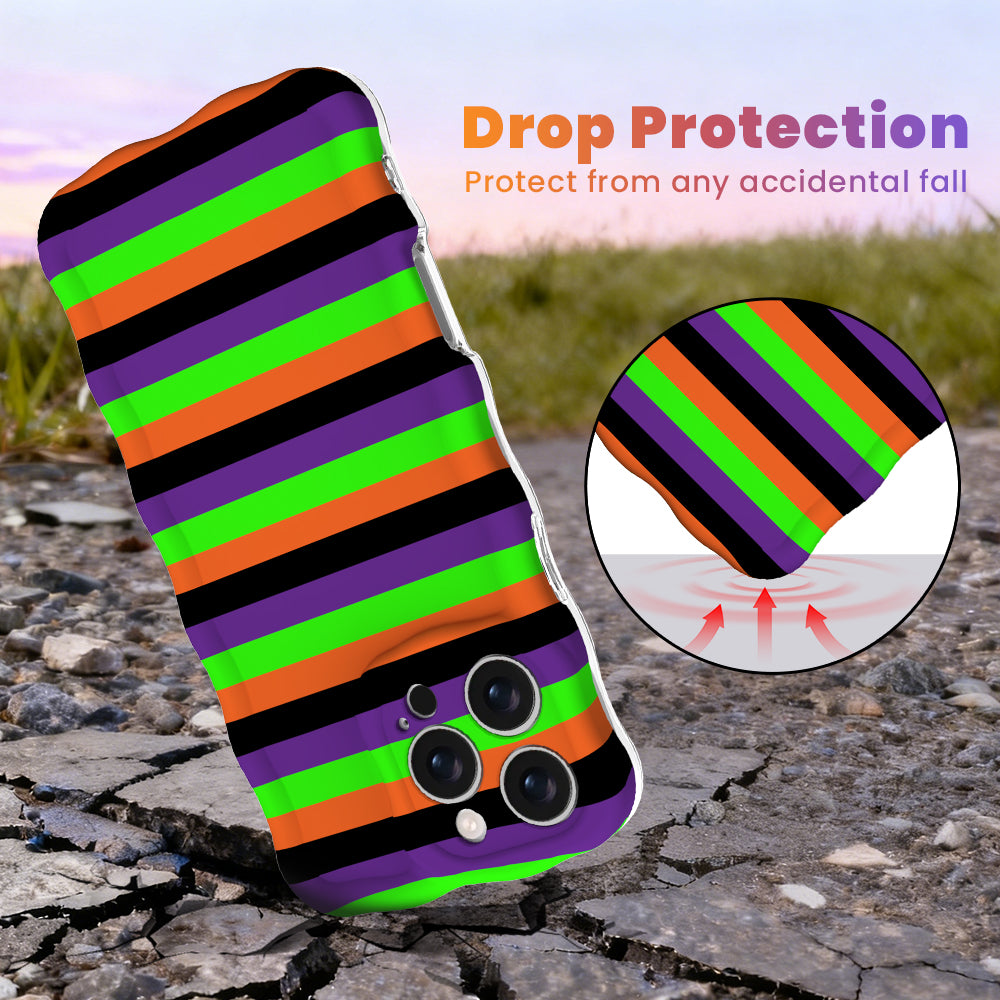 Drop protection diagram for the Main Witch Energy Wavy Luxe MagSafe iPhone case, black, purple, green and orange stripes, showing the cushioned corner.