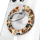 Sienna Petals Hold It Fancy MagSafe grip ring on a clear iPhone case, cream ring printed with watercolor rust and orange flowers and olive leaves.