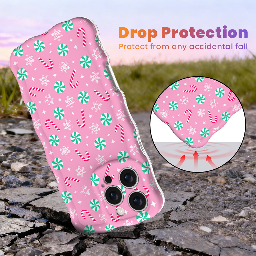 Peppermint Cutie Wavy Luxe MagSafe iPhone case, bubblegum pink with mint peppermints, candy canes and snowflakes, with shock-absorbing corners for drop protection