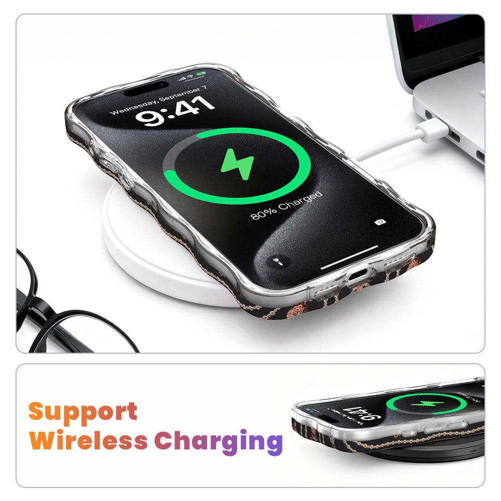 iPhone in the Pretty Little Details black pearl and rose case charging on a white wireless pad, showing the case supports wireless and MagSafe charging without being removed.