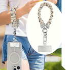 Deer Joy White scrunchie wrist strap worn on the wrist with an iPhone hanging from it, plus close-up of the strap and phone tab