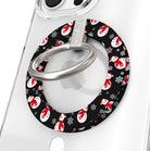 Close-up of the Snowman MagSafe grip ring, black print with white snowmen in red scarves and Santa hats, with brushed silver ring on a clear iPhone case