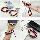 Four views of the Buffalo Plaid Snowflake scrunchie phone wrist strap: with its phone tab, dangling from a phone in hand, worn on the wrist, and clipped to a pouch zipper