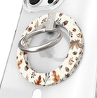 Nutty For Fall Hold It Fancy MagSafe grip ring close-up on a clear iPhone case, showing the cream ring painted with watercolor acorns and rust oak leaves around the silver rotating metal ring.