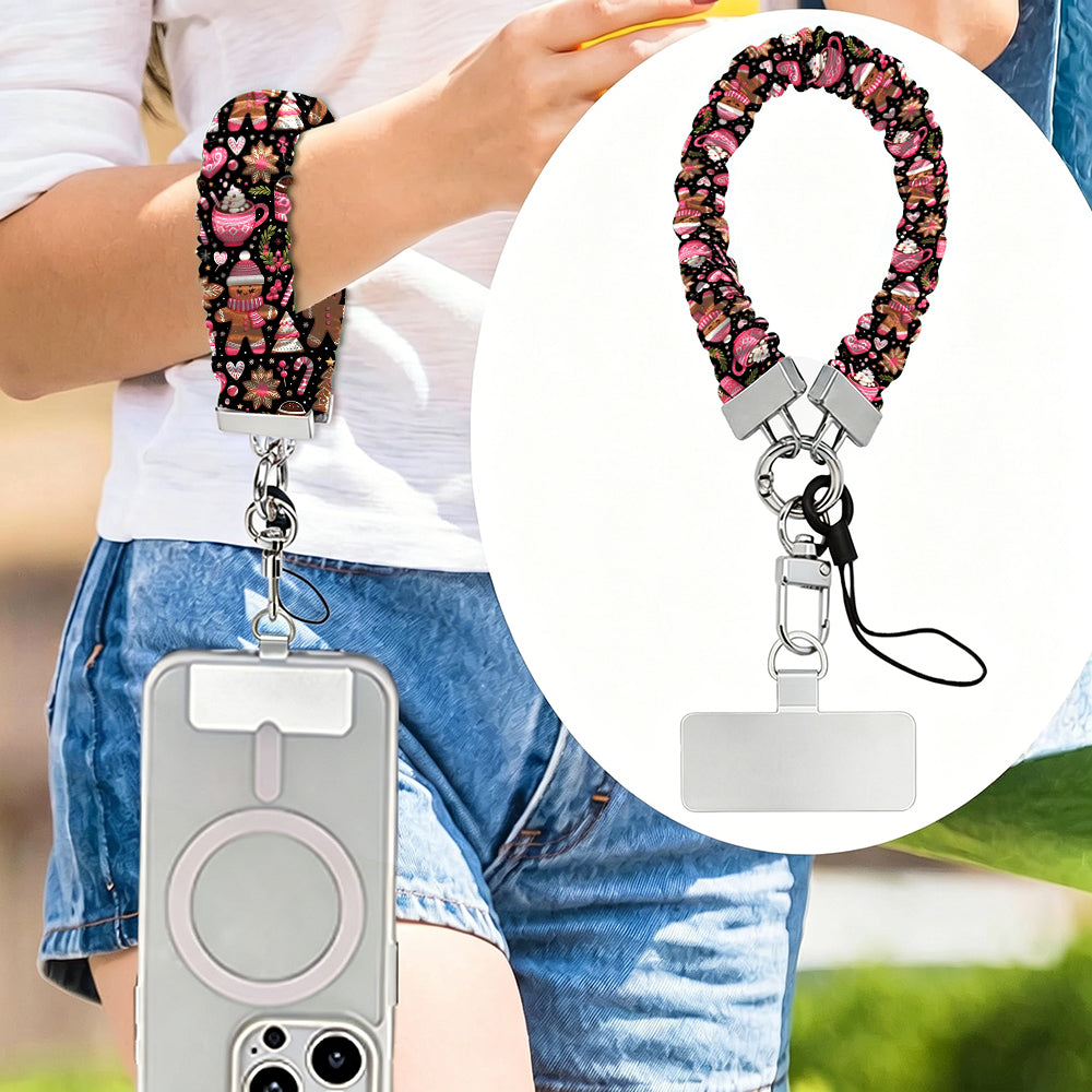 Merry Mugs & Ginger Hugs scrunchie phone strap worn on the wrist with an iPhone hanging from it, plus close-up of the strap and phone tab
