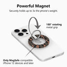 Diagram of the Pretty Little Details black pearl and rose MagSafe grip ring on a white iPhone, showing the 180 degree rotating metal grip and a magnet that holds three times the phone's weight.