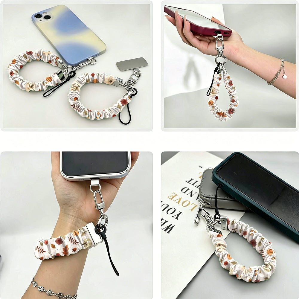 Four ways to use the Fall Floral Bliss scrunchie phone wrist strap: clipped to a phone case, held in the hand, worn on the wrist, and resting beside a phone on a book.