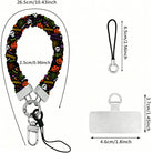 Size diagram for the Spooky scrunchie phone wrist strap, black with pumpkins and skulls, showing the 26.5 cm loop and 2.5 cm width.