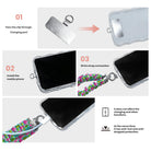 3 steps to attach a Merry & Bright, Totally! scrunchie phone wrist strap: pass the tab through the charging port, fit the case, clip on the wrist strap