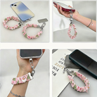 Four ways to use the Jolly Pink Santa scrunchie phone wrist strap: with its phone tab, dangling from a phone, worn on the wrist and clipped to a bag