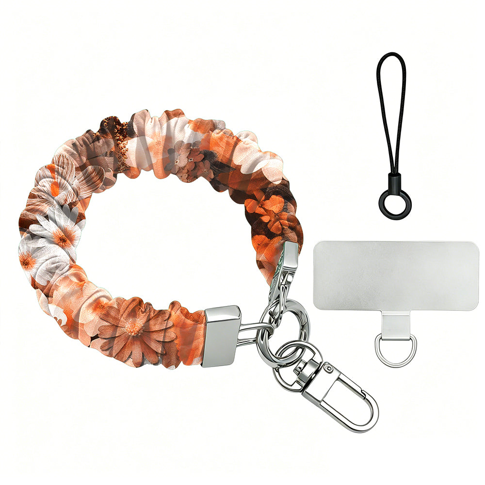Fall Blooms autumn floral scrunchie phone wrist strap in orange and cream with silver clasp and clear phone attachment tab on a white background