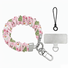 Jolly Pink Santa scrunchie phone wrist strap laid flat, Santas and Christmas trees on pink, with silver clasp, lanyard loop and phone tab