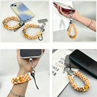Happy Fall Y'all orange gingham and pumpkin scrunchie phone wrist strap from Fancy Bands