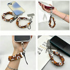 Four ways to use the Harvest Sunflowers scrunchie phone wrist strap: clipped to a phone case, held in the hand, worn on the wrist, and resting beside a phone on a book.