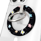 Flower Pop pattern MagSafe phone grip ring with sketched colorful flowers and script text on black background compatible with iPhone and Samsung