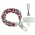 Hey Boo, Looking Cute Scrunchie Phone Wrist Strap shown with its metal clasp, black cord and phone attachment tab, pink and black checkerboard with white ghosts.