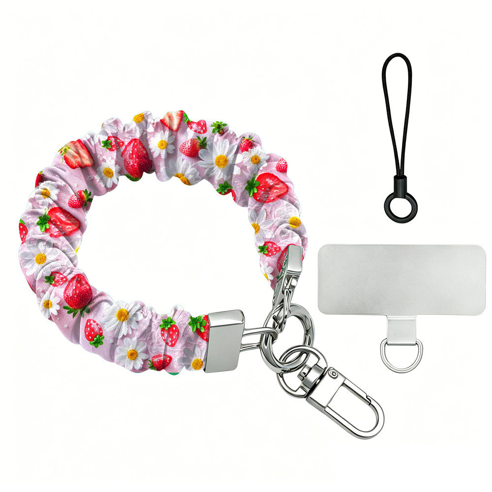 Berry Cute Blooms Scrunchie Phone Wrist Strap shown with its silver lobster clasp, black loop cord and phone attachment tab, pink fabric printed with strawberries and white daisies.