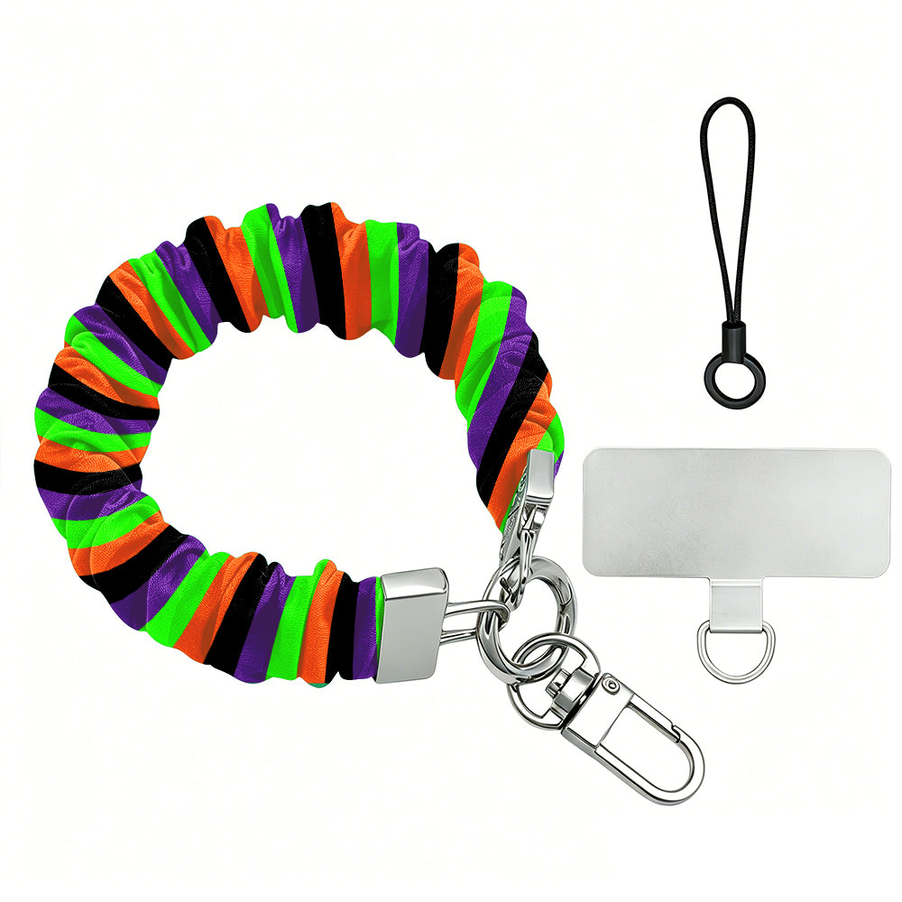 Main Witch Energy scrunchie phone wrist strap shown with its metal clasp and phone attachment tab, striped in black, purple, neon green and orange.