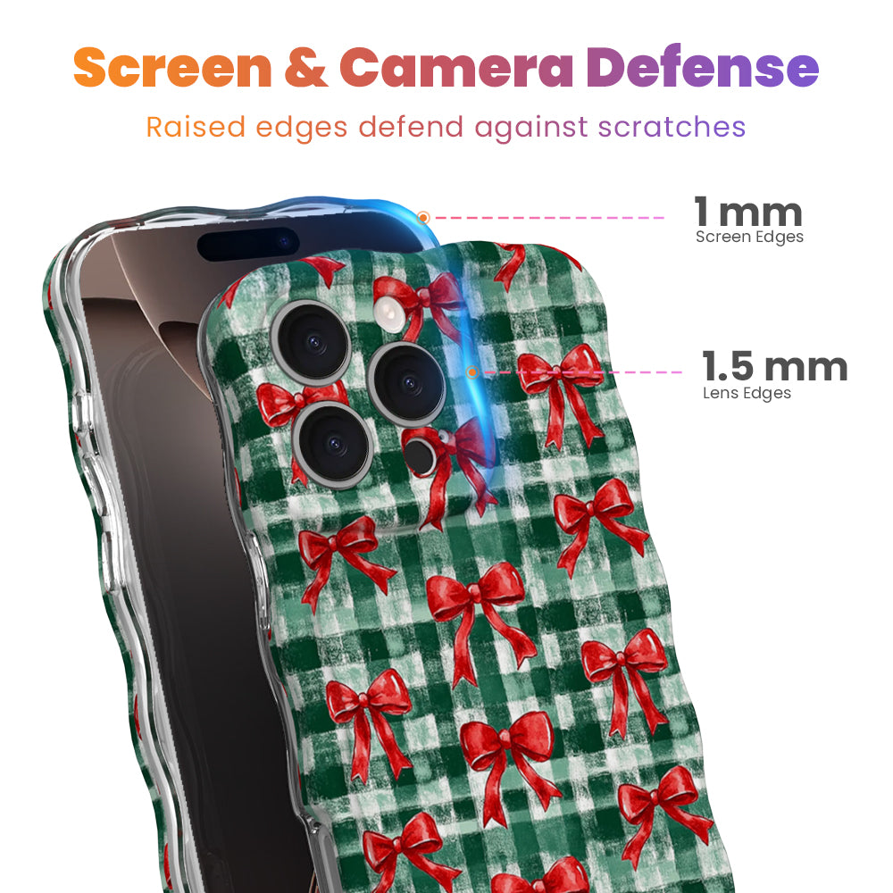 Plaid Tidings & Bows iPhone case with 1 mm raised screen edges and 1.5 mm raised camera lens edges, cherry-red bows on evergreen check