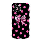 Sweet Spot MagSafe iPhone case with hot pink polka dots and cowhide bow on black by Fancy Bands
