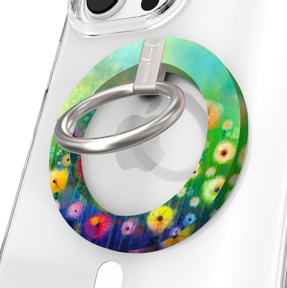 Petal Princess watercolor floral MagSafe phone grip ring with vibrant pink and yellow blooms on green background compatible with iPhone and Samsung