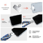 Three-step installation guide for The Bewitching Hour Scrunchie Phone Wrist Strap, fitting the attachment tab through the charging port opening.
