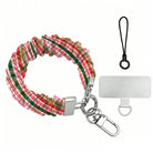 Merry Little Plaid scrunchie phone wrist strap laid flat with silver clasp and phone tab, pink, red and green Christmas plaid