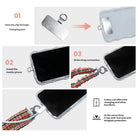 3 steps to attach a Merry Little Plaid scrunchie phone wrist strap: pass the tab through the charging port, fit the case, clip on the wrist strap