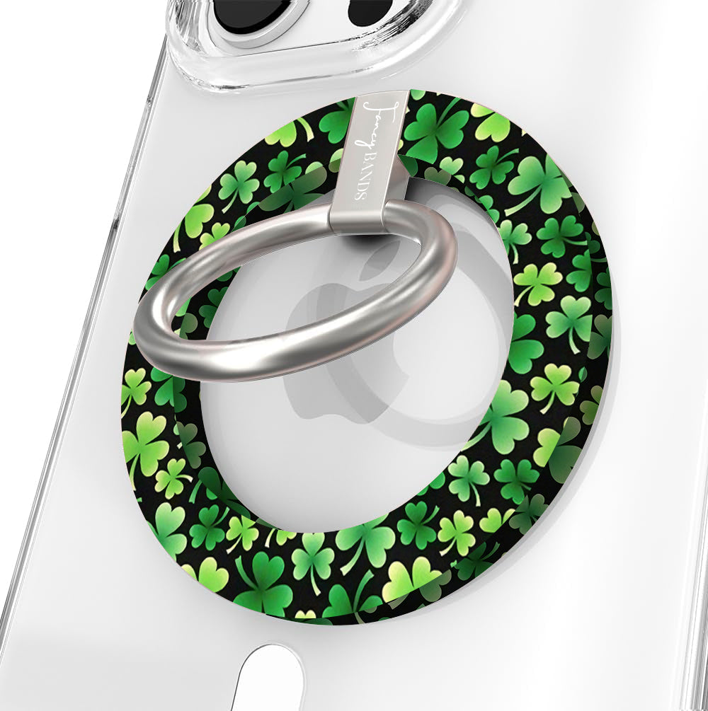 Shamrock pattern MagSafe phone grip ring with green clovers on a black background compatible with iPhone and Samsung