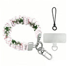 Pretty in PinkMas scrunchie phone wrist strap laid flat with silver clasp and phone tab, pink and white stripes with little bow-tied Christmas trees
