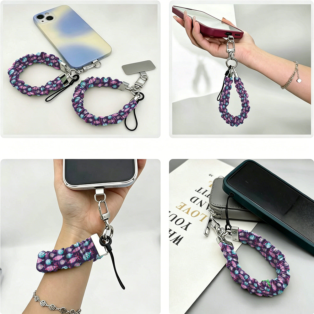 Four views of the Just One More Ornament scrunchie phone wrist strap: with its phone tab, dangling from a phone in hand, worn on the wrist, and clipped to a bag