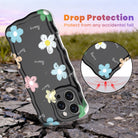 Black wavy iPhone case featuring hand-drawn doodle flowers in pink, blue, and yellow with a glossy finish.