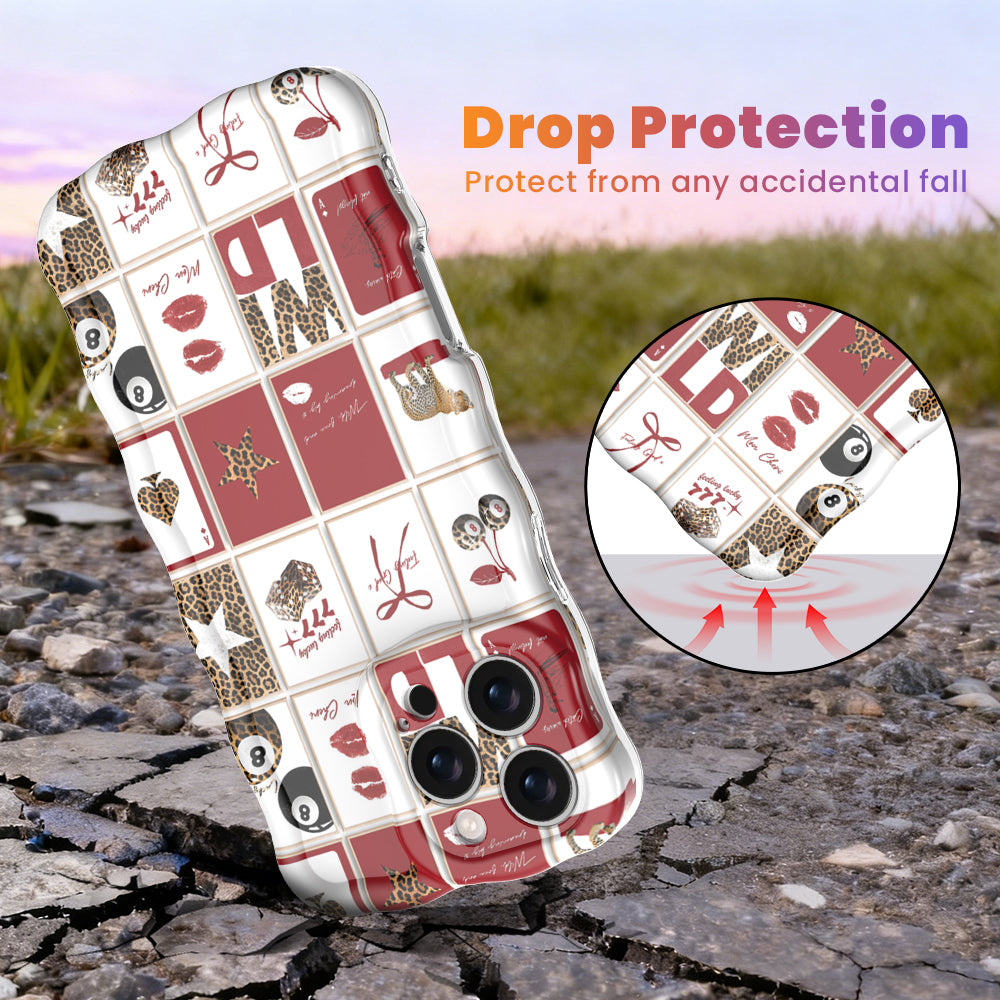Trendy red and white wavy iPhone case featuring a collage of leopard print cherries, 8-balls, red lips, and lucky 777 dice with a high-gloss finish.