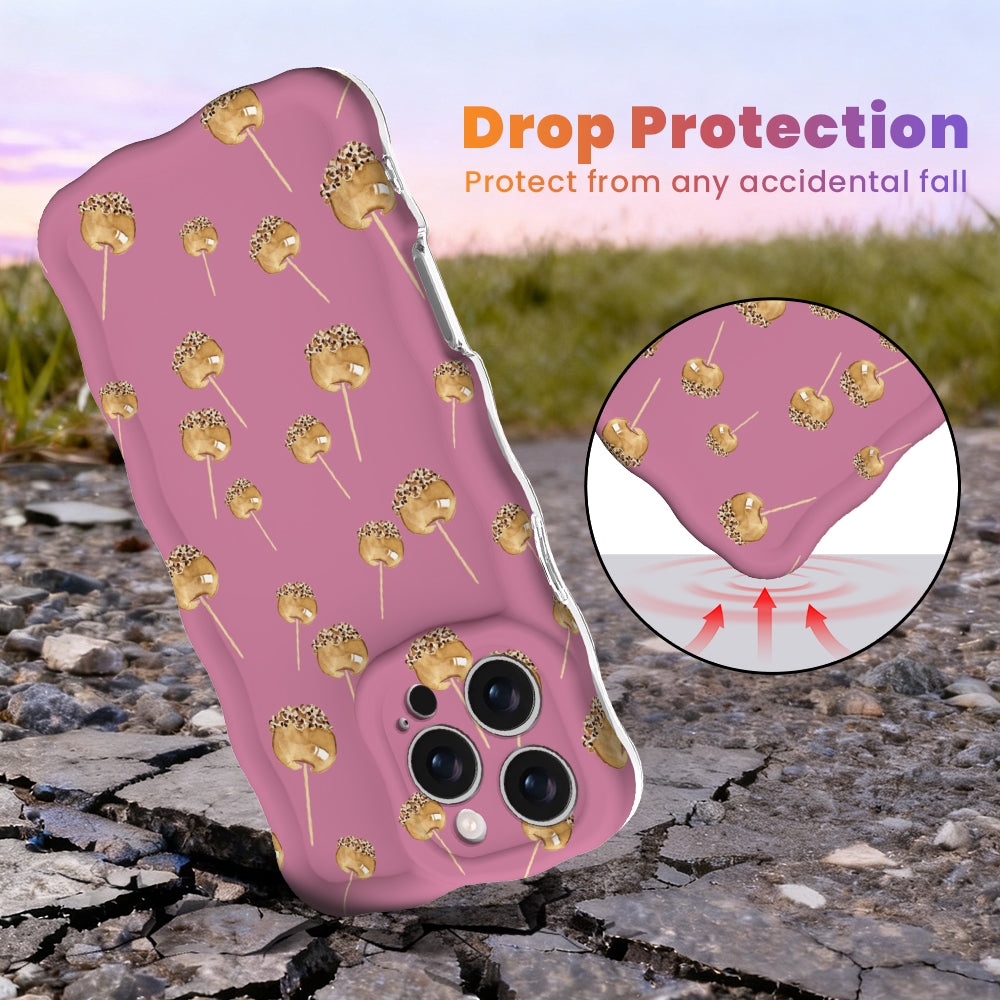 Drop protection diagram for the Caramel Coated Cutie Wavy Luxe iPhone case, showing the shock-absorbing raised edges that protect the pink caramel apple case against accidental falls.