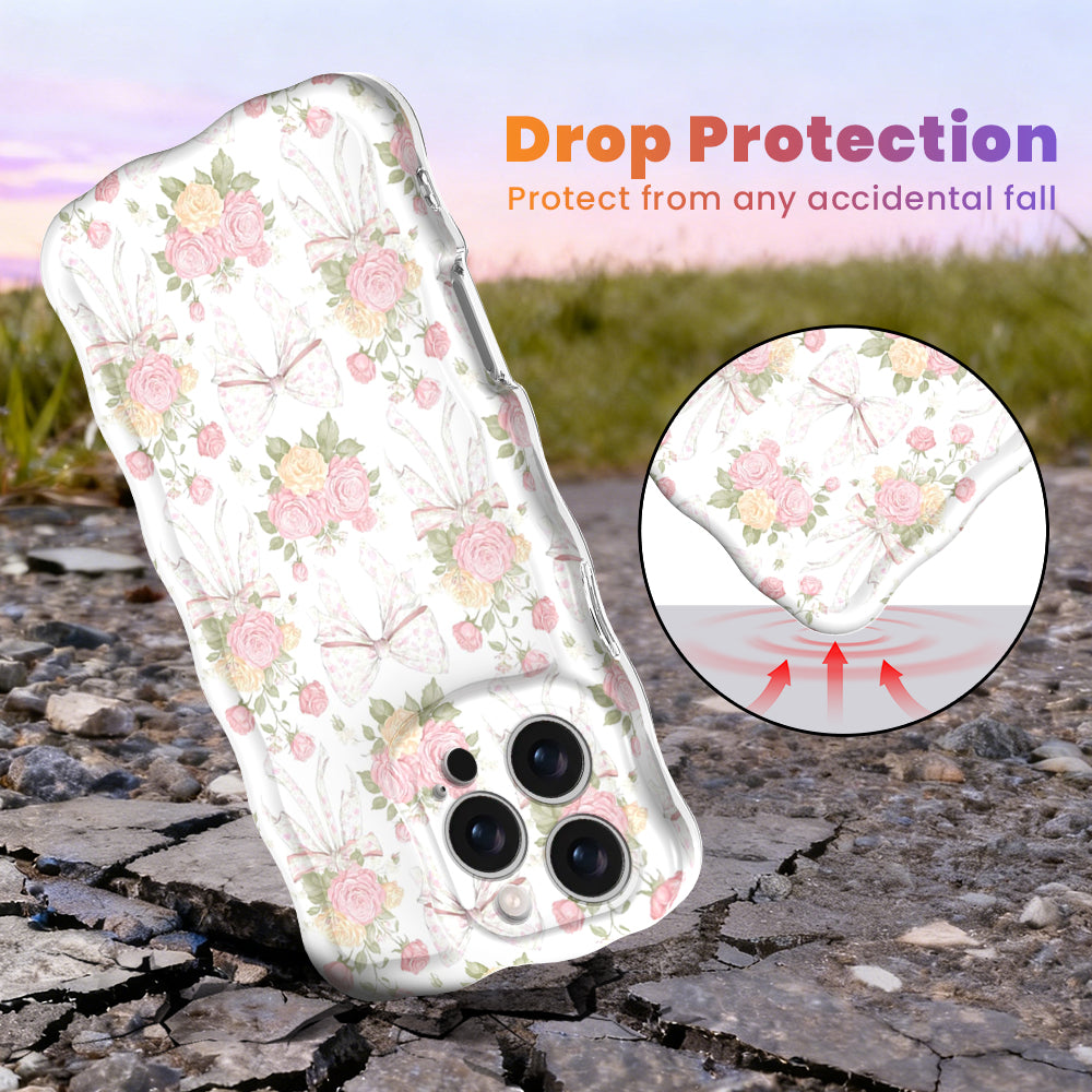 Cream wavy iPhone case featuring a vintage pattern of pink and yellow roses tied with white ribbons and bows.
