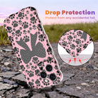 Trendy pink wavy iPhone case featuring a pattern of black paw prints and a large central black bow with tiny paw print details.