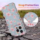 Drop protection diagram for the Autumn Breeze Wavy Luxe iPhone case, showing the shock-absorbing raised edges that protect the blue and blush maple leaf print against accidental falls.