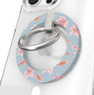 Autumn Breeze Hold It Fancy MagSafe grip ring close-up on a clear iPhone case, showing the slate blue ring with blush maple leaves and wheat sprigs around the silver rotating ring.