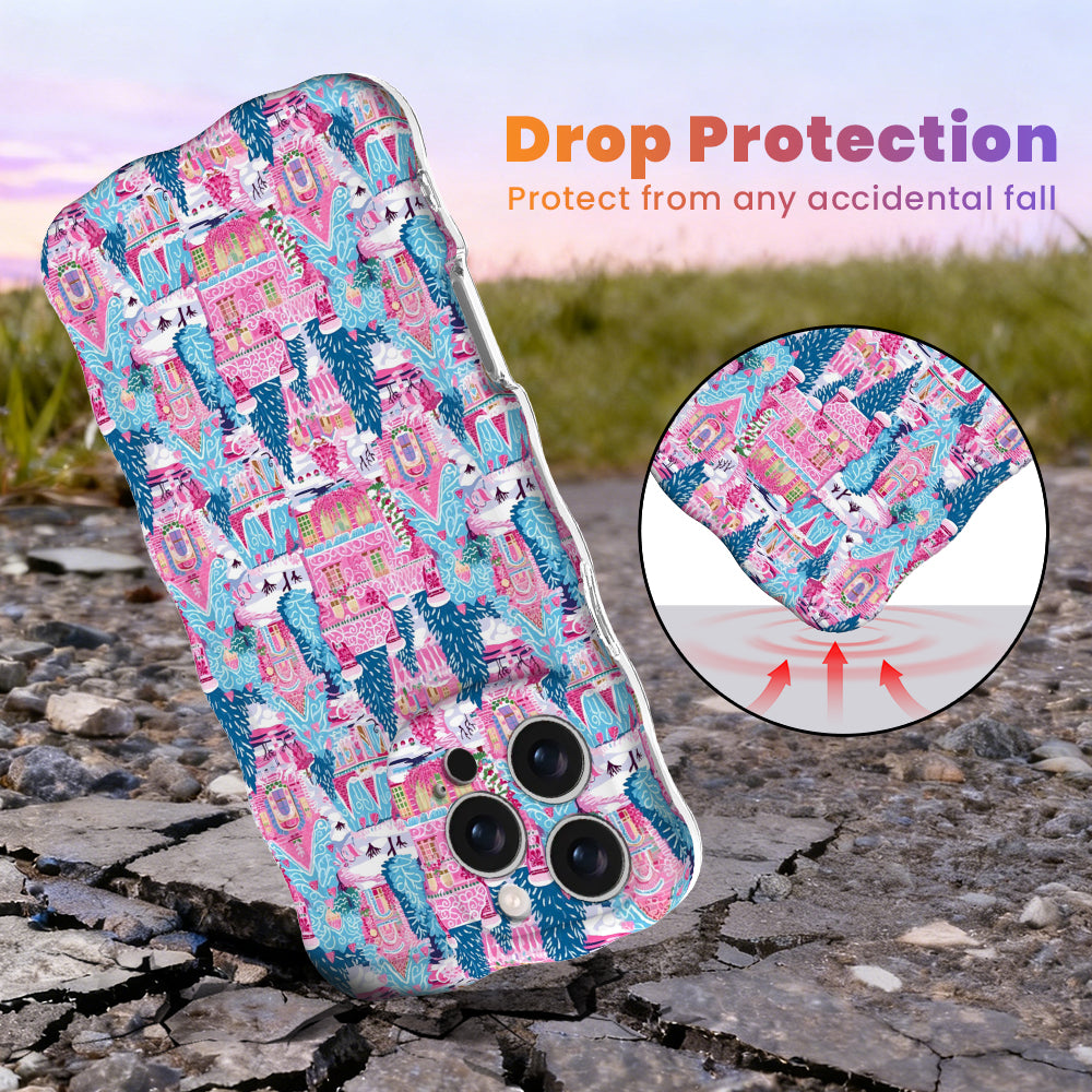 Sugarplum Square Wavy Luxe MagSafe iPhone case, pink gingerbread houses and blue pines, with shock-absorbing corners for drop protection