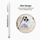 Side view of the slim Sugarplum Square grip ring with collapsible ring, and a phone with the Christmas village grip sliding into a jeans pocket