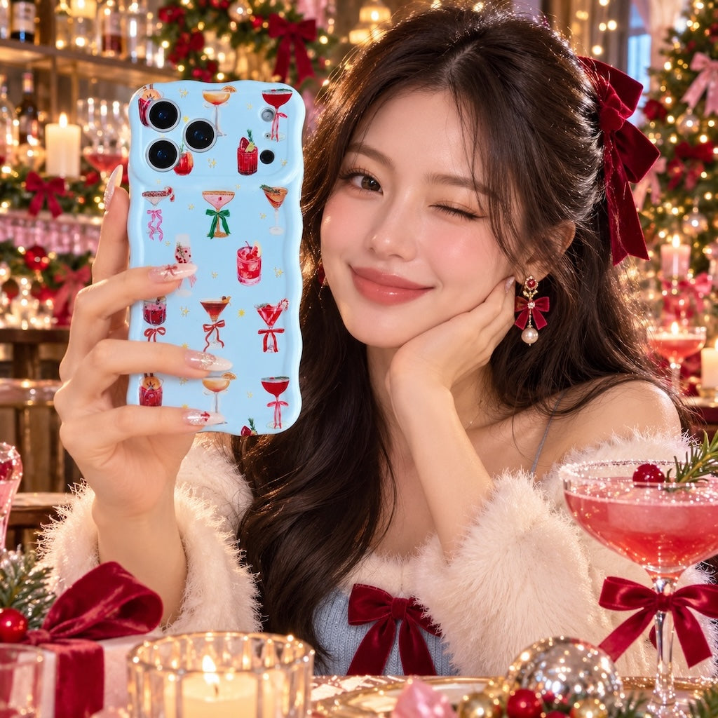 Woman in a white fluffy top with a red bow holding the Holiday Spirits, Please? iPhone case beside a pink holiday cocktail