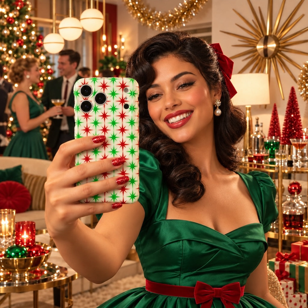 Woman in an emerald satin dress taking a selfie with the Tinsel & Stardust iPhone case at a retro Christmas cocktail party