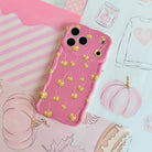 Caramel Coated Cutie Wavy Luxe MagSafe iPhone case flat lay on a pink fall mood board with striped paper, pumpkin sketches, and a Fall sweatshirt illustration.