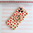 Sweetheart Blooms pattern MagSafe phone grip ring with red hearts and pink roses on cream background compatible with iPhone and Samsung